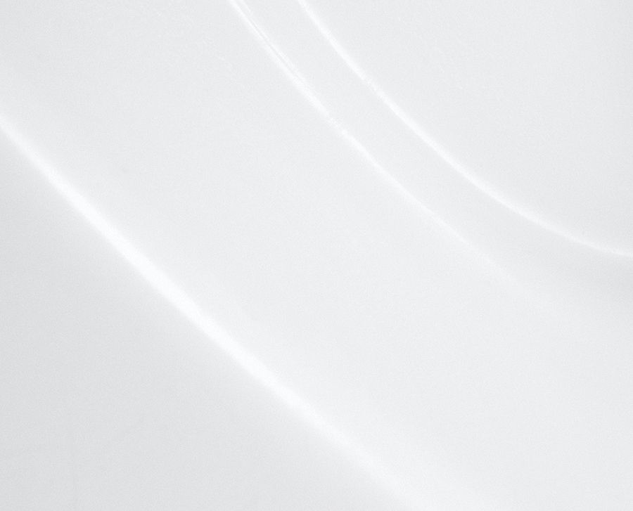 Curved white surface with smooth texture.