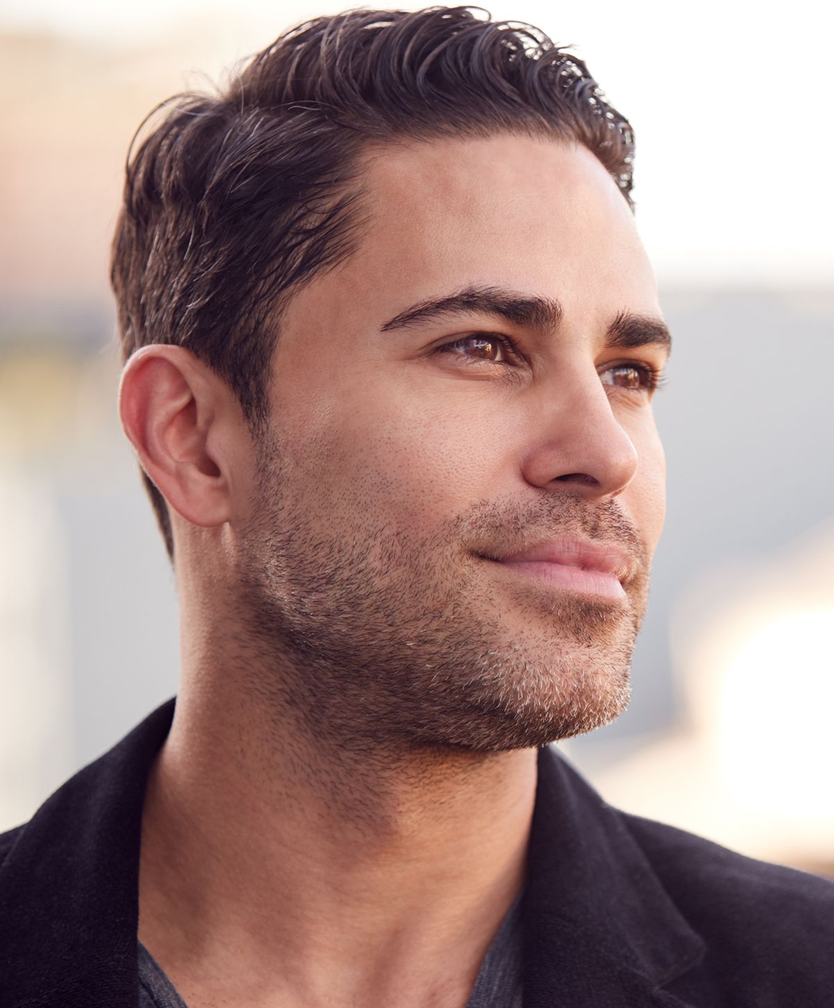 Man with short dark hair and beard.