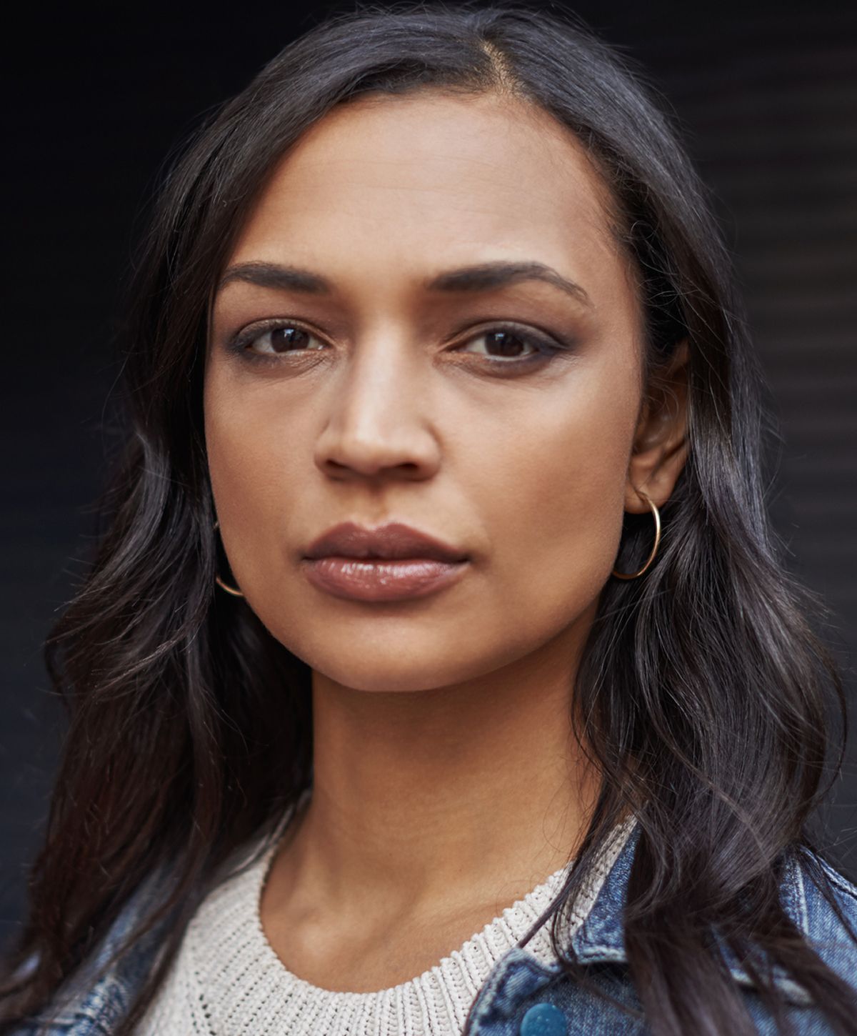 Close-up portrait of a woman with dark hair.