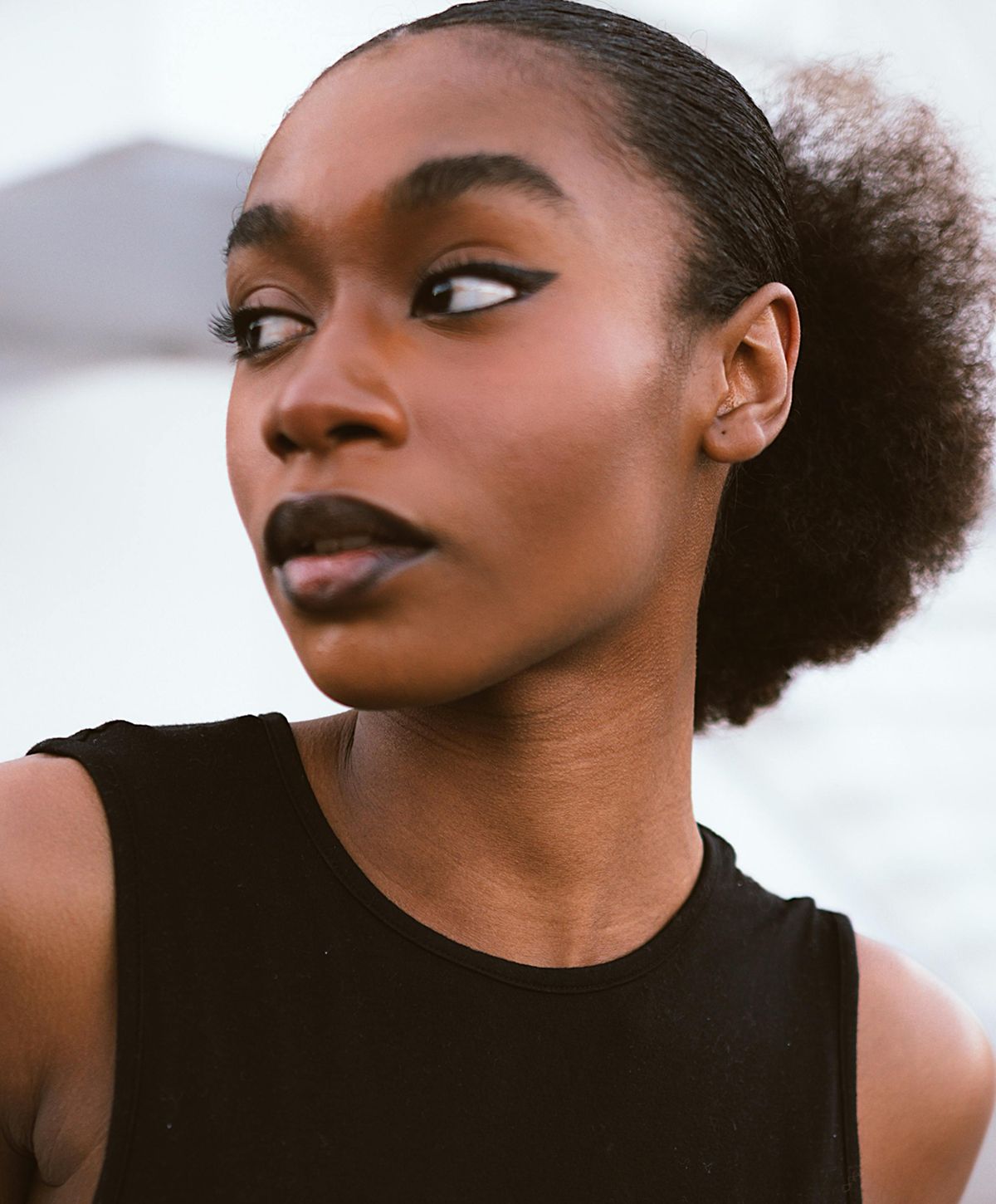 Portrait of a woman with bold makeup.