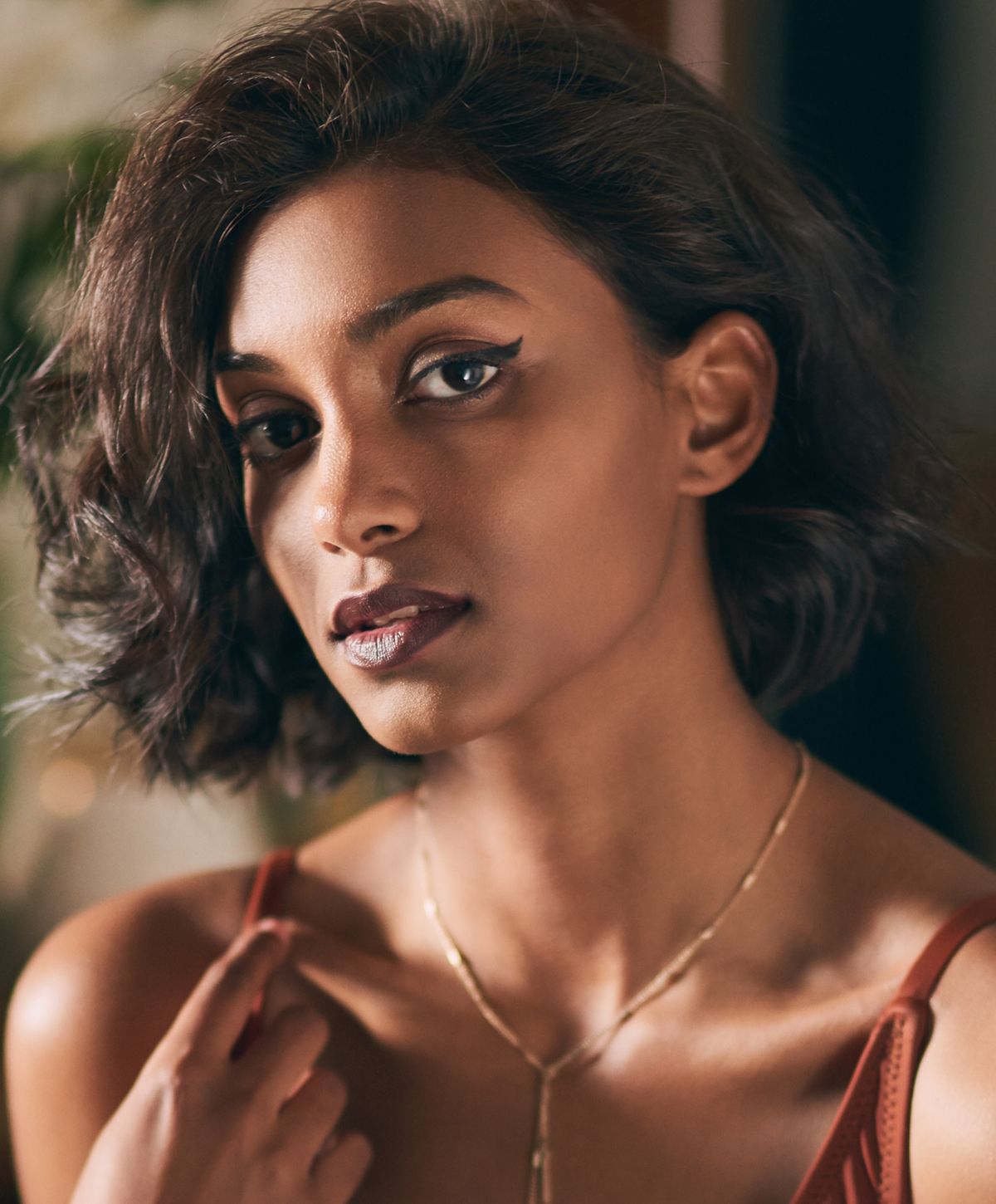 Portrait of a woman with short, curly hair.
