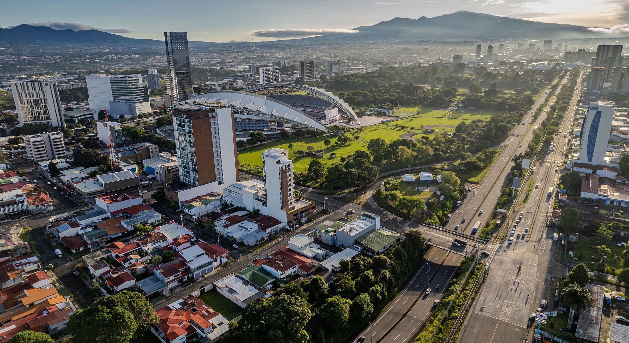 Aerial view of urban cityscape with mountains.