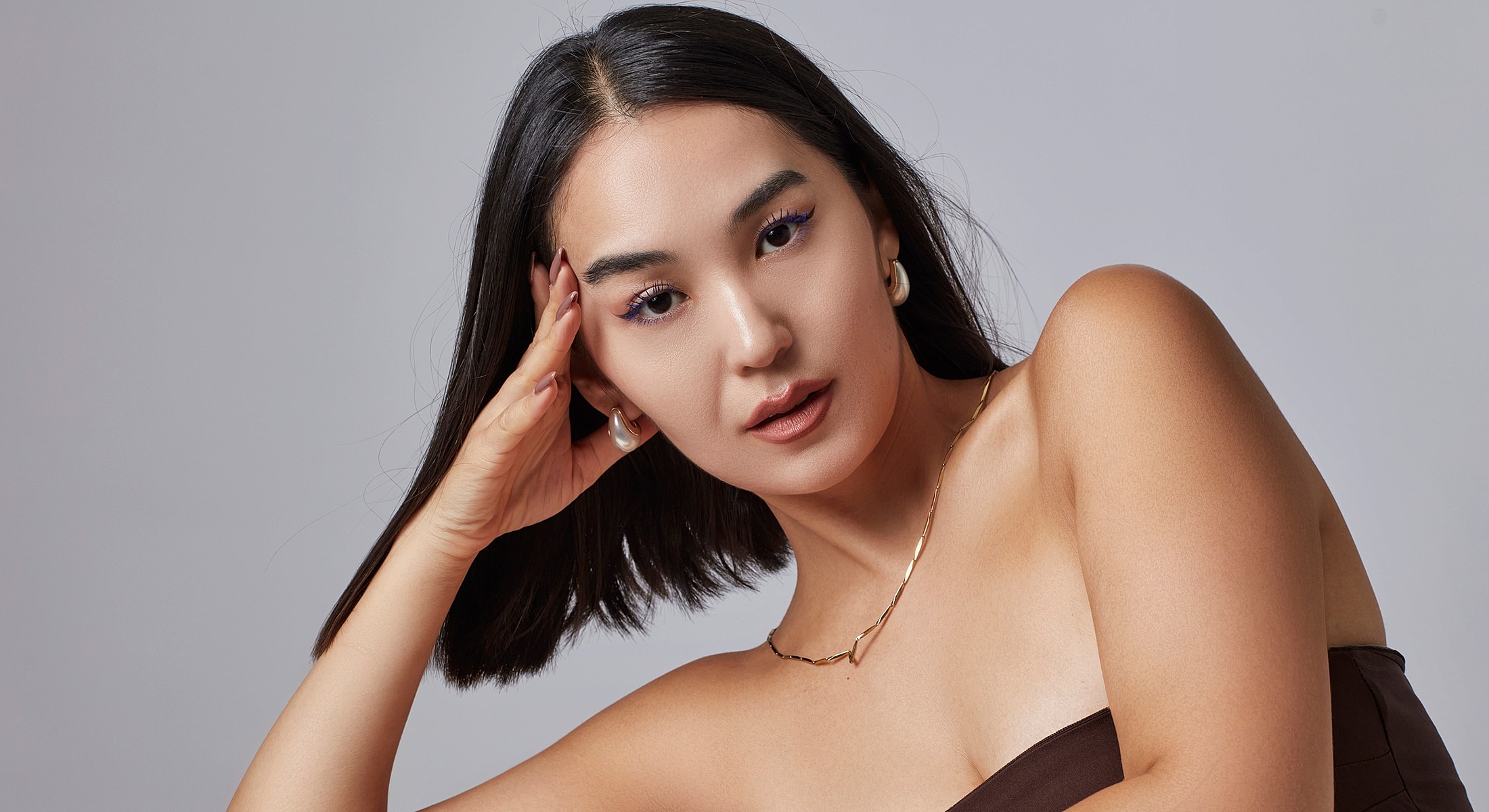 Confident woman posing with stylish accessories.