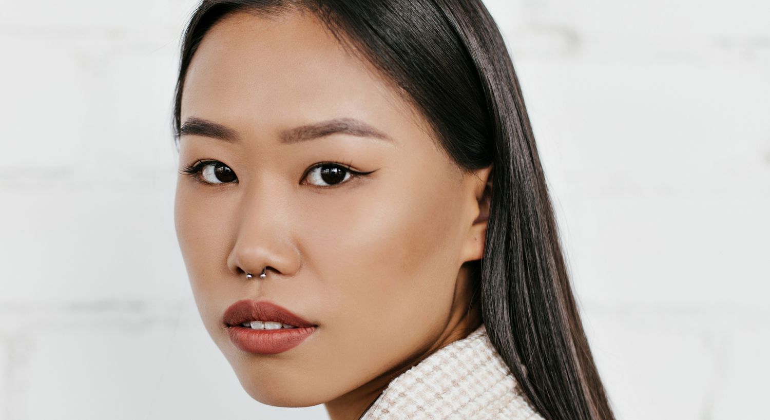 Portrait of a young woman with stylish features.