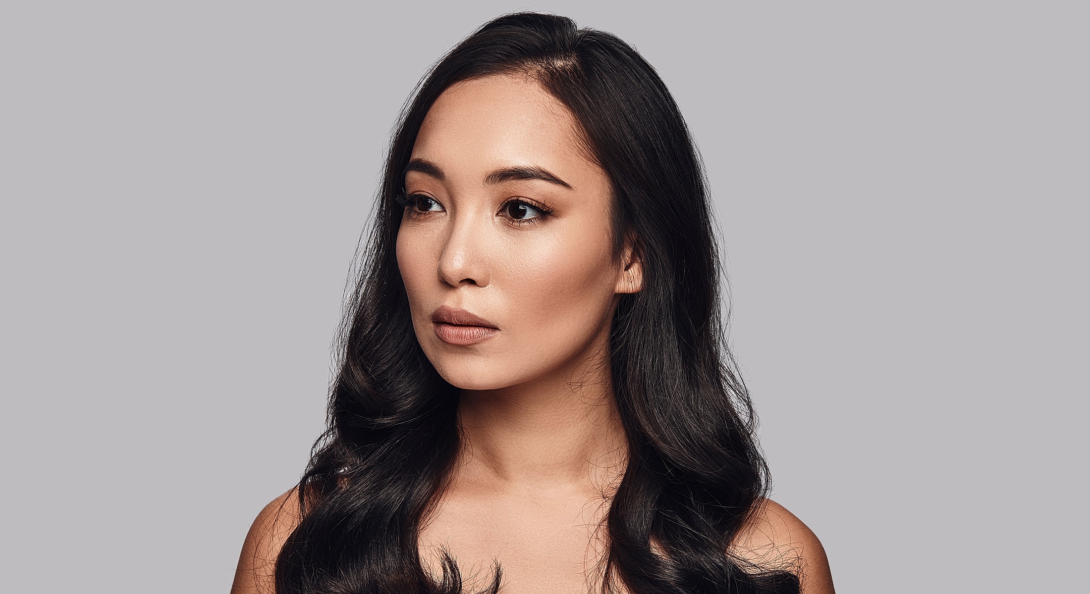 Portrait of a woman with long, dark hair.